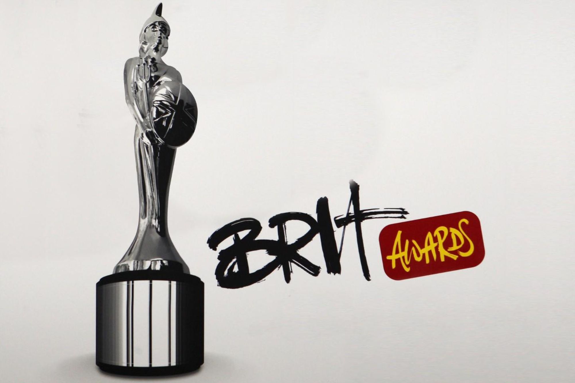 Премия slay 2024. Brits статуэтка. Премия Brit статуэтка. Брит Авардс. Brit Awards награда.